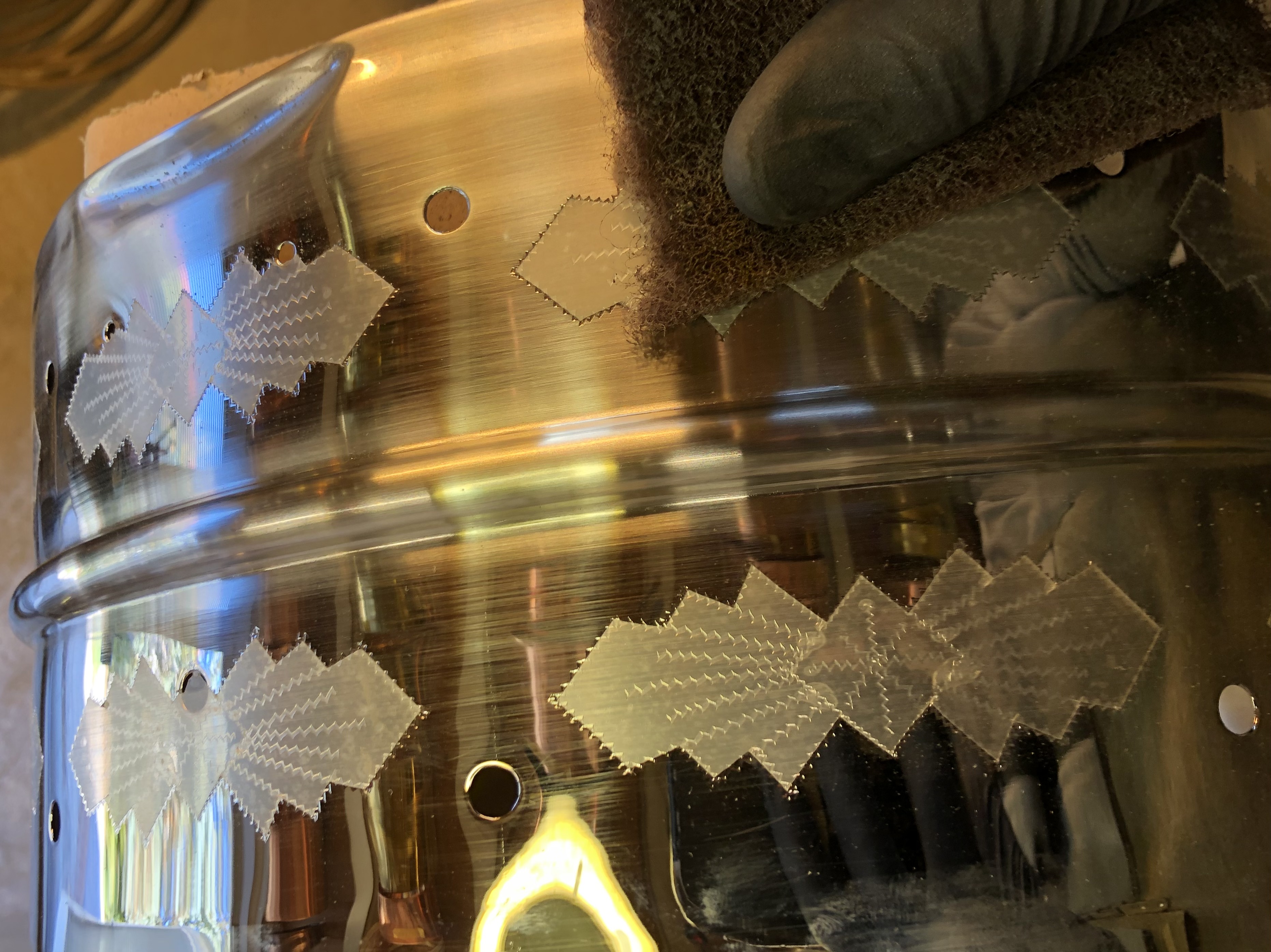 covered engraving - slowly hand brushing the shell